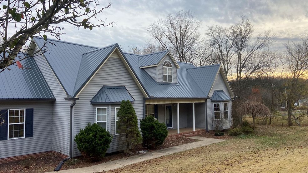 Blue classic panel metal roof on a home in Portland, Tennessee