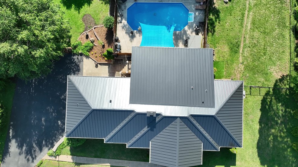 Black standing seam metal roof and poolside elevation in Brentwood, TN