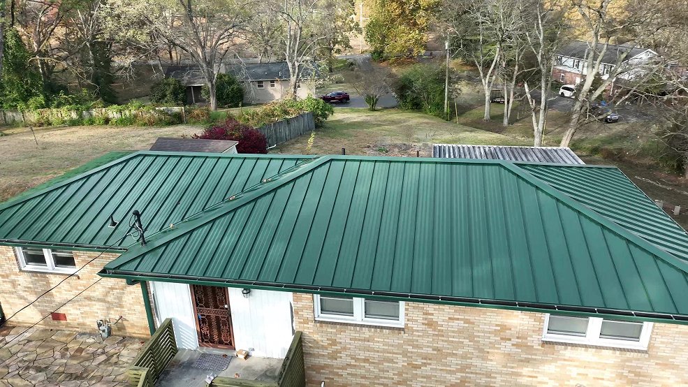Green standing seam metal roof and covered porch in Goodlettsville, Tennessee