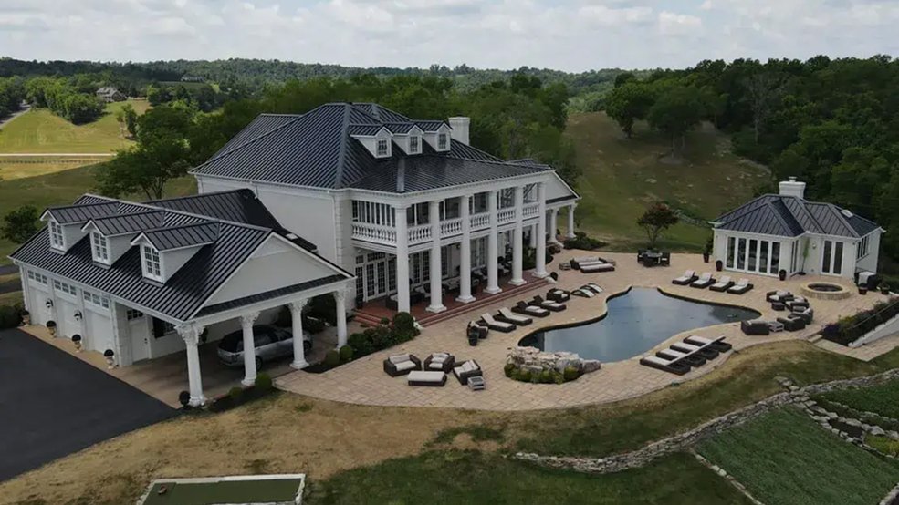 Solar panels mounted on a black aluminum metal shingle roof in Thompson's Station, TN