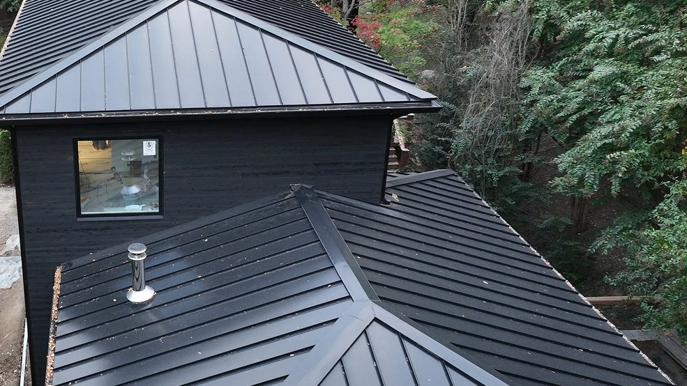 Classic green metal roof over a porch in Gallatin, Tennessee