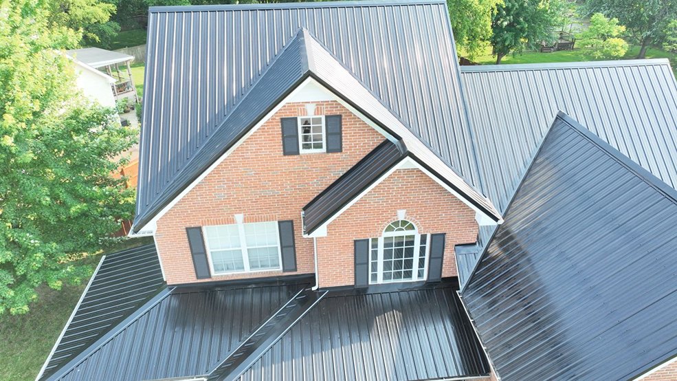 Completed black standing seam metal roof on a ranch home in Mt. Juliet, Tennessee