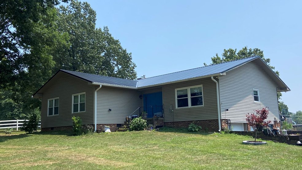 Black classic panel metal roof on a grassland ranch home in Smyrna, TN