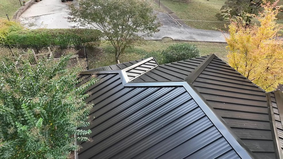 Black standing seam metal roof and eave detail on a ranch home in Mt. Juliet, Tennessee