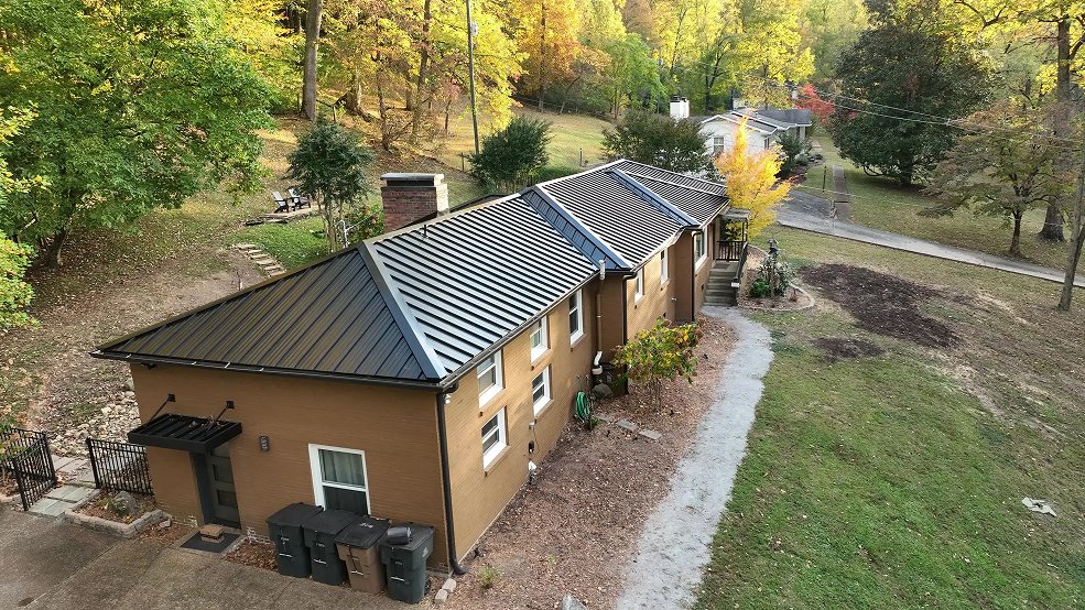 Black standing seam metal roof and rear elevation of a ranch home in Mt. Juliet, Tennessee
