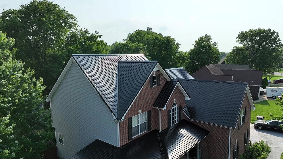 Black classic panel metal roof on a brick home in Hendersonville, TN