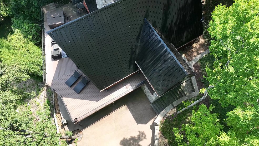 Black classic panel metal roof on a mid century modern cabin in Fairview, Tennessee