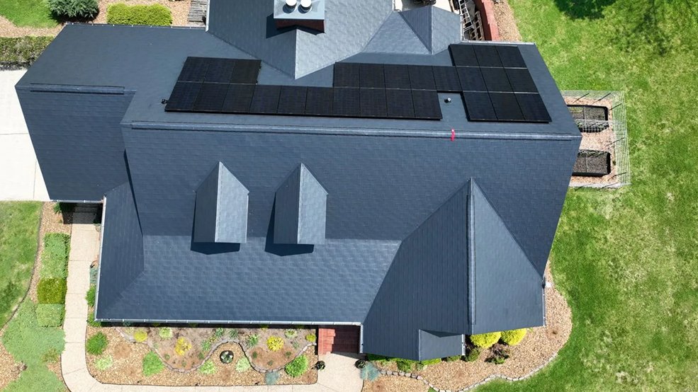 Black aluminum metal shingle roof with a solar panel system in Germantown, Tennessee