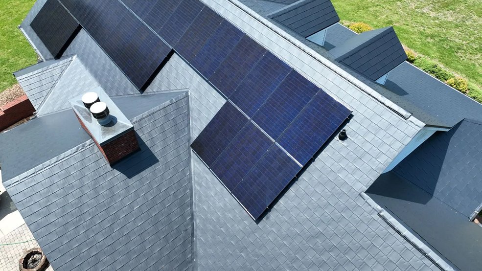 Solar array mounted on a black aluminum metal shingle roof in Germantown, TN