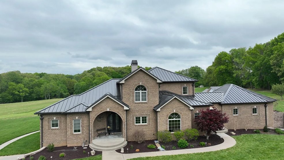 Bronze standing seam panels across an estate roof in Belle Meade, Tennessee