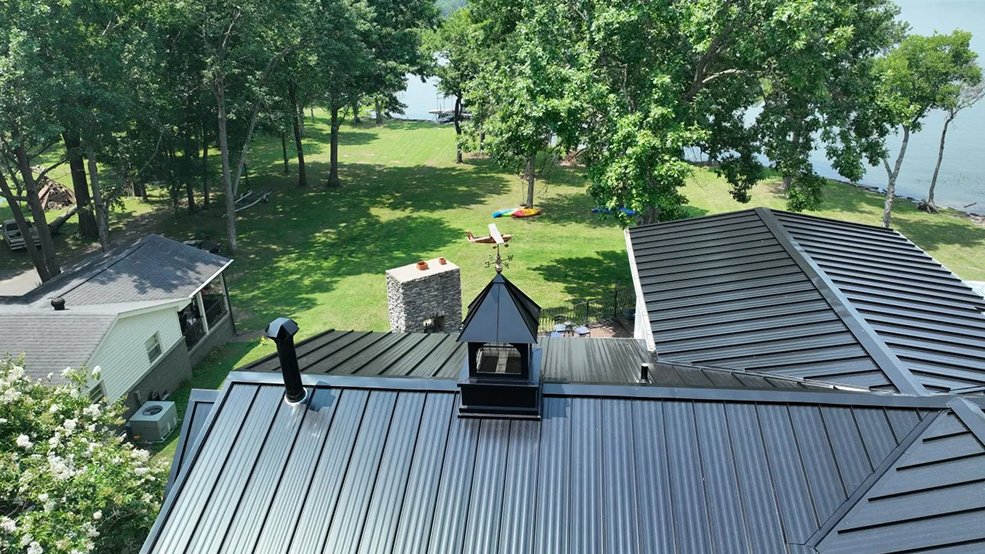 Black standing seam metal roof with accent detail on a lake house in Hendersonville, Tennessee