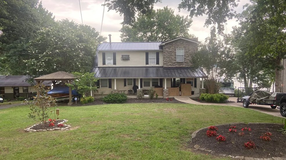 Black standing seam metal roof on a lake house in Hendersonville, TN