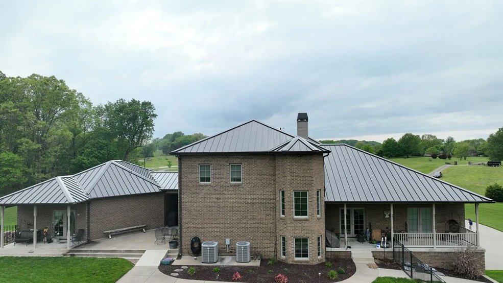 Bronze standing seam metal roof on a large estate home in Belle Meade, Tennessee