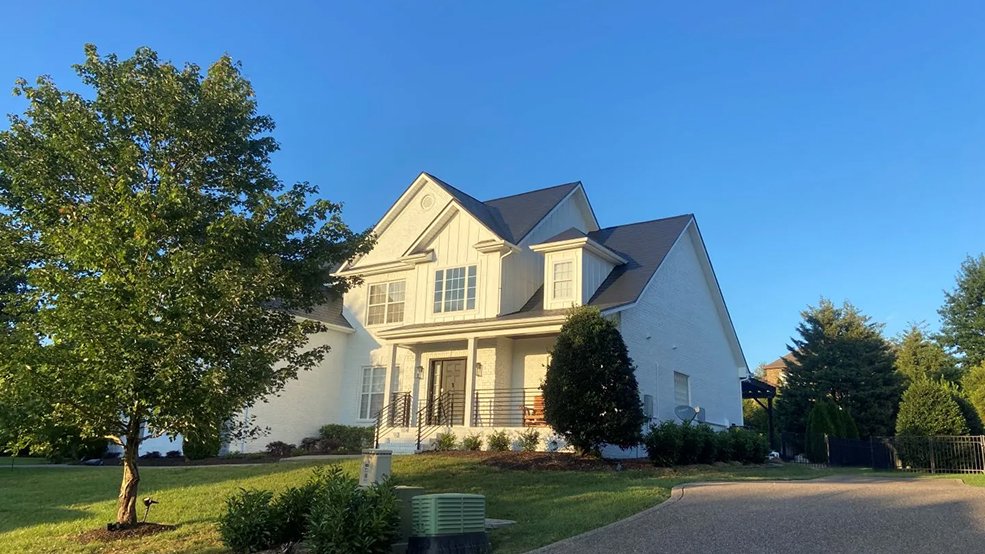 Black aluminum metal shingle roof on a two story family home in Germantown, Tennessee