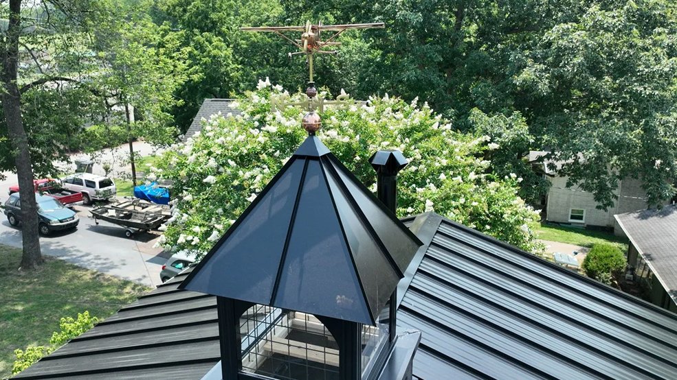 Black standing seam metal roof and accent panel on a lake house in Hendersonville, Tennessee