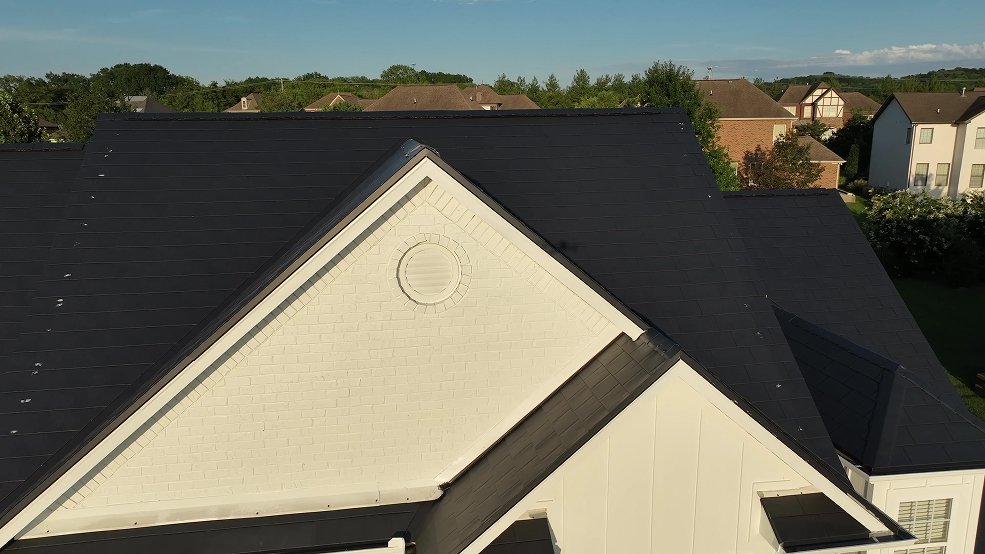 Black aluminum metal shingle roof and dormer on a suburban home in Germantown, Tennessee