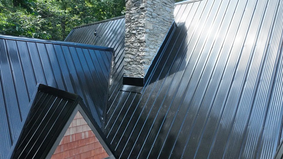 Black classic panel metal roof on a modern cabin in Fairview, TN