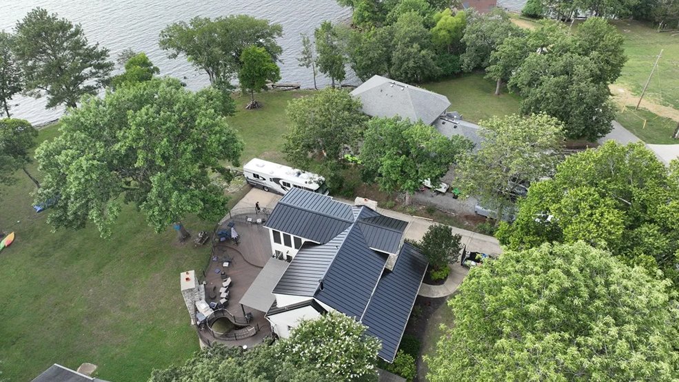 Black standing seam metal roof and lakefront elevation in Hendersonville, Tennessee