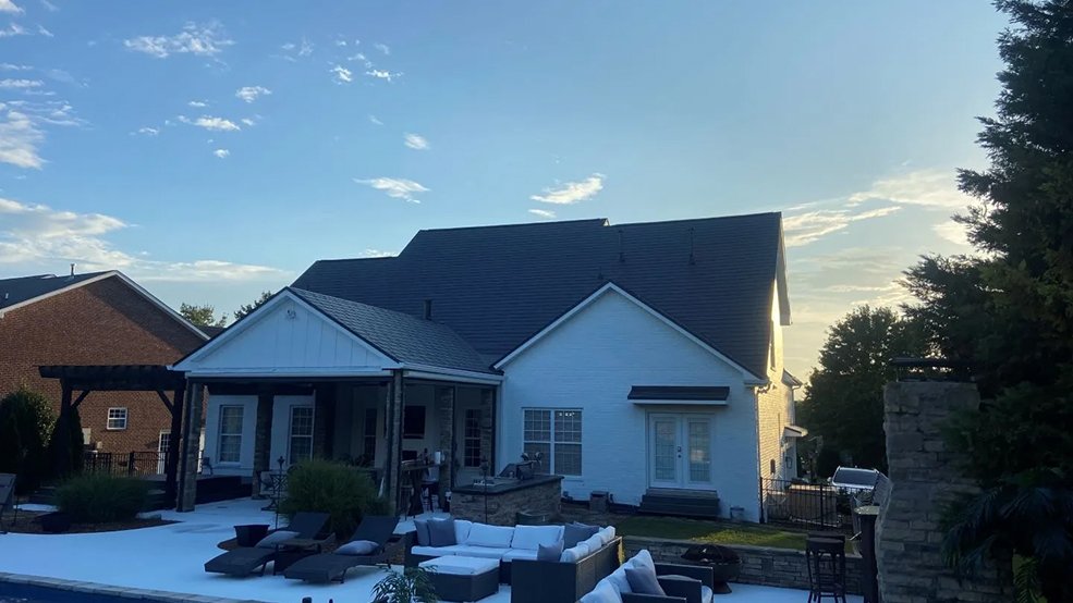 Black aluminum metal shingle roof and garage elevation in Germantown, TN