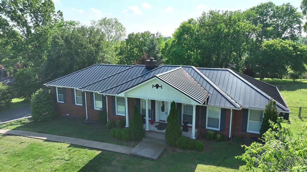 Gray standing seam metal roof and eave detail in Cumberland City, TN
