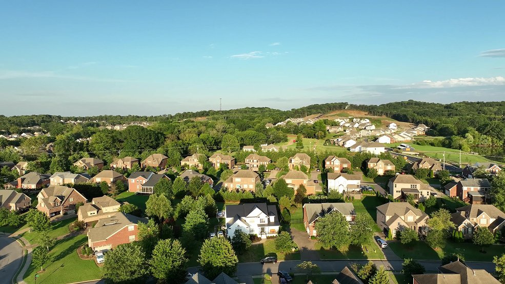 Black aluminum metal shingle roof and roofline on a family home in Germantown, Tennessee