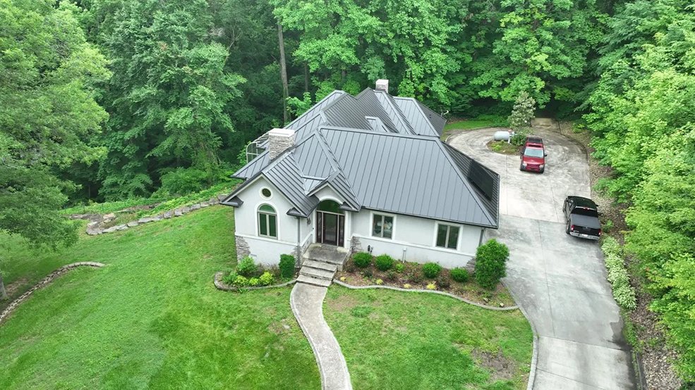 Standing seam metal roof carrying a solar panel array in Antioch, Tennessee
