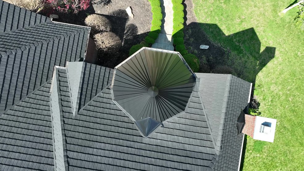 Custom metal shingle roof and turret tower on a cottage home in Franklin, Tennessee