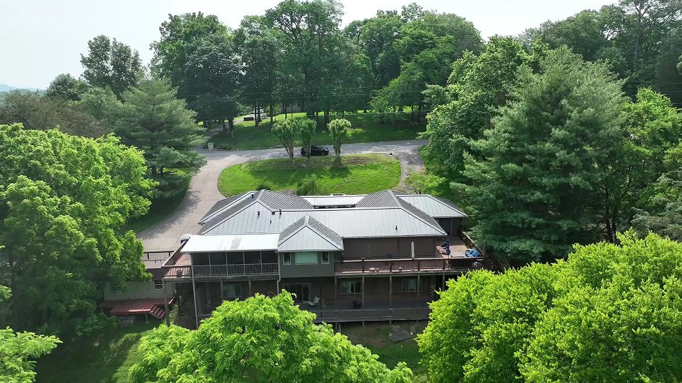 Bronze standing seam metal roof around a courtyard home in Belle Meade, Tennessee