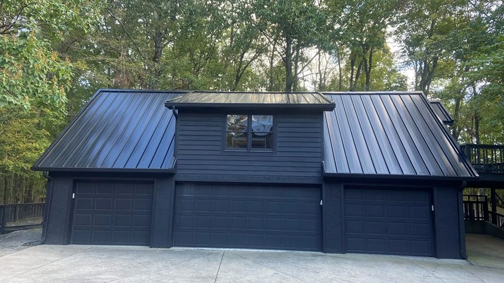 Black standing seam panels on a mid century modern roof in Nashville, Tennessee