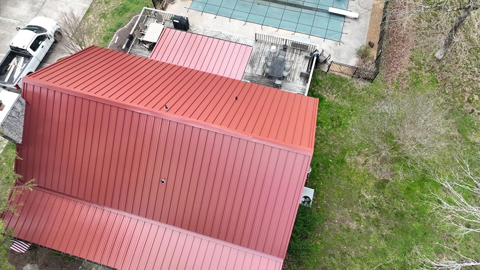 Red classic panel metal roof and cabin porch in Sparta, TN