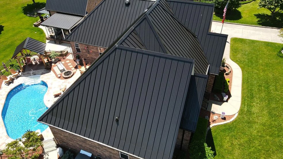 Black standing seam metal roof and crisp eave lines in Brentwood, TN