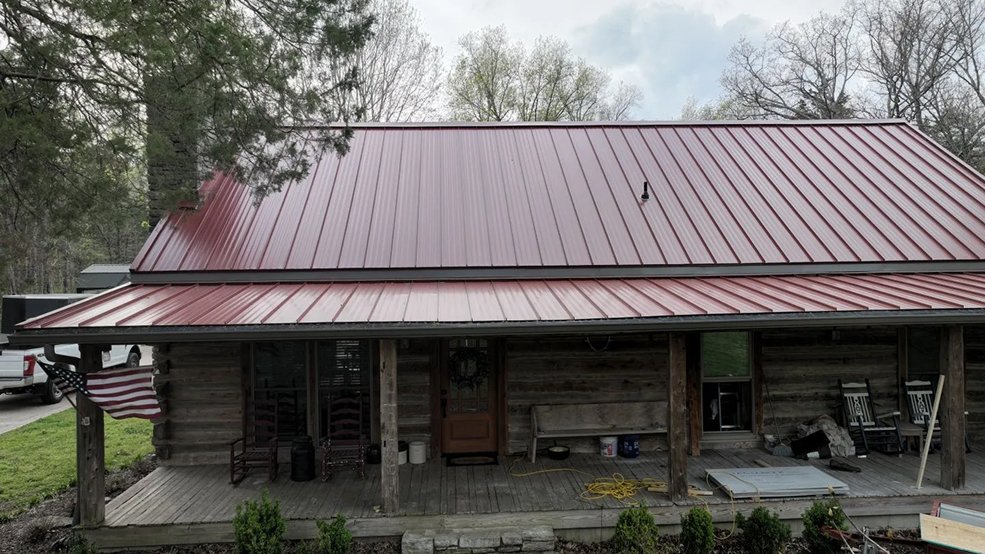 Red classic panel metal roof and cabin gable in Sparta, Tennessee