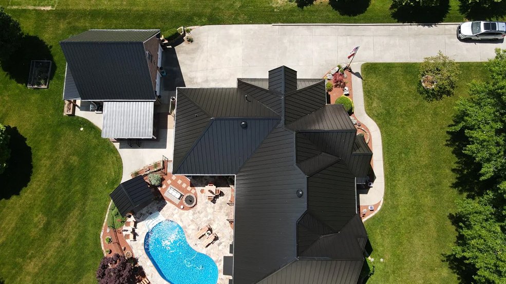 Black standing seam metal roof and sharp gable on a home in Brentwood, Tennessee