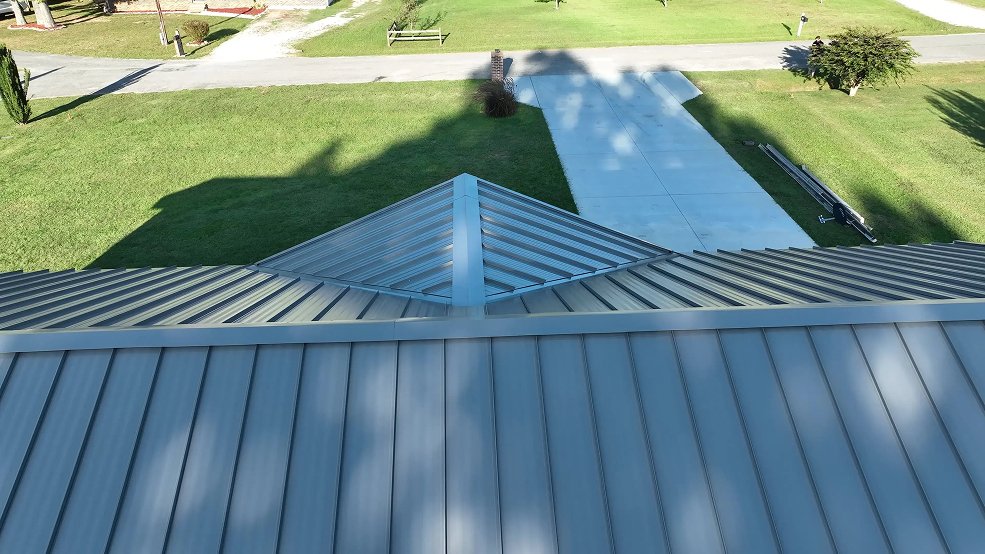 Gray standing seam metal roof across a farm ranch home in Lebanon, Tennessee