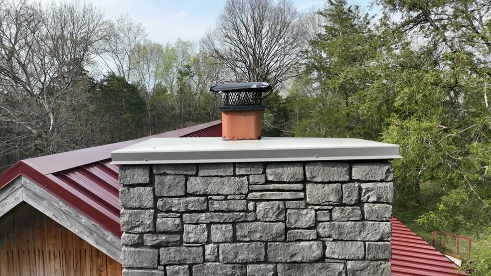 Red classic panel metal roof on a cabin home in Sparta, TN