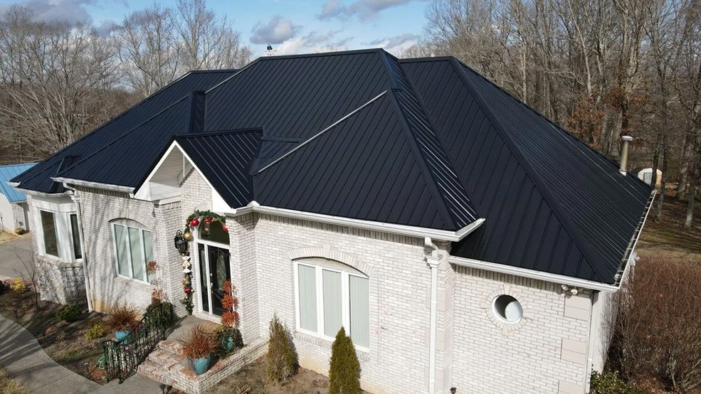 Black standing seam metal roof and full elevation of a ranch home in Mt. Juliet, Tennessee