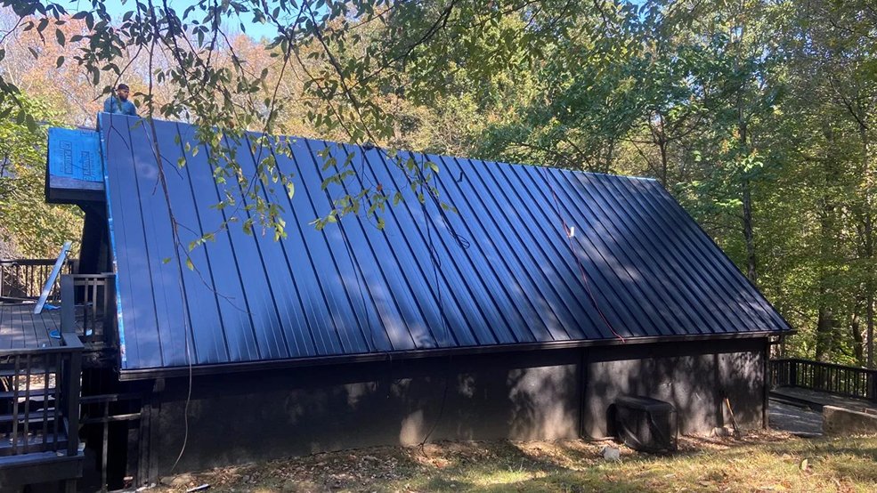 Black standing seam metal roof on a mid century modern home in Nashville, TN