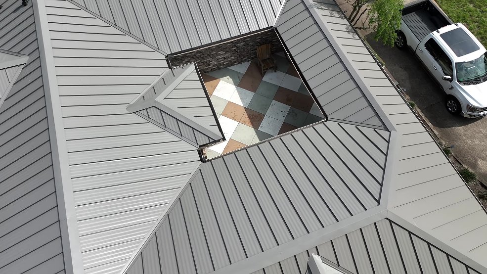 Bronze standing seam metal roof and courtyard wing in Belle Meade, Tennessee
