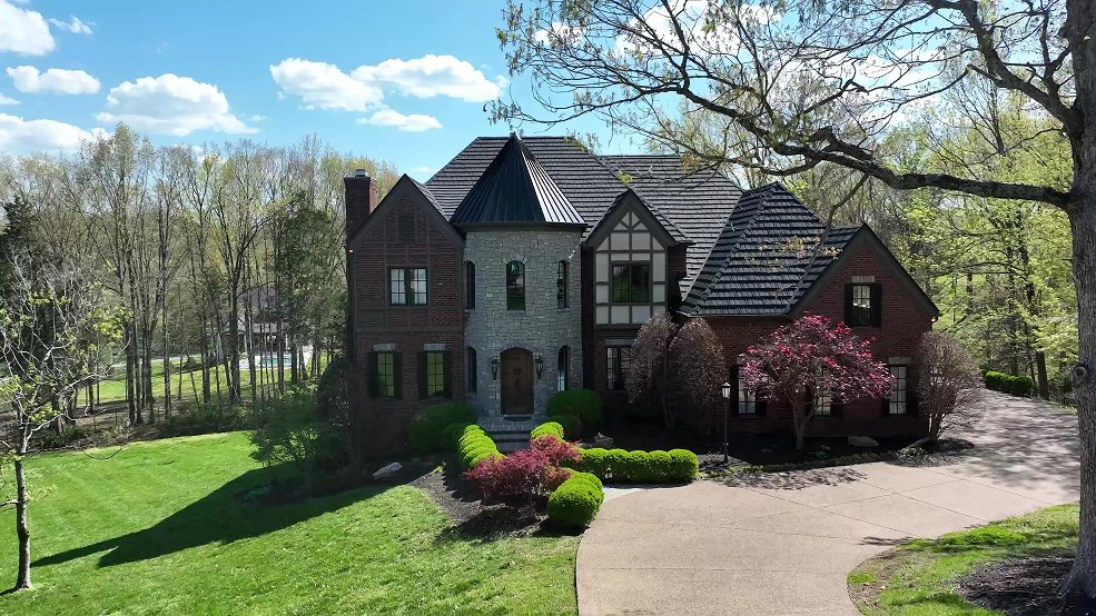 Custom metal shingle roof and turret detail on a cottage home in Franklin, Tennessee