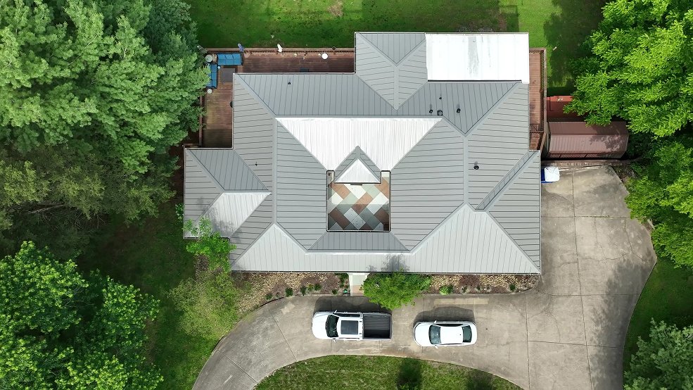Bronze standing seam metal roof on a courtyard home in Belle Meade, Tennessee