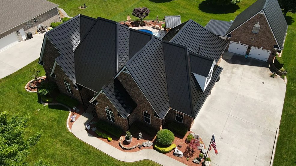 Black standing seam metal roof and clean roofline on a home in Brentwood, TN