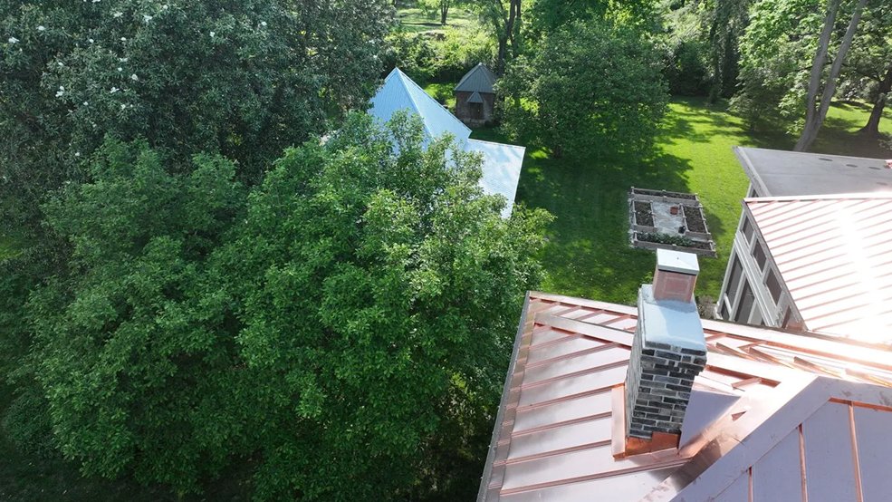 Copper standing seam metal roof and stone gable in Franklin, Tennessee