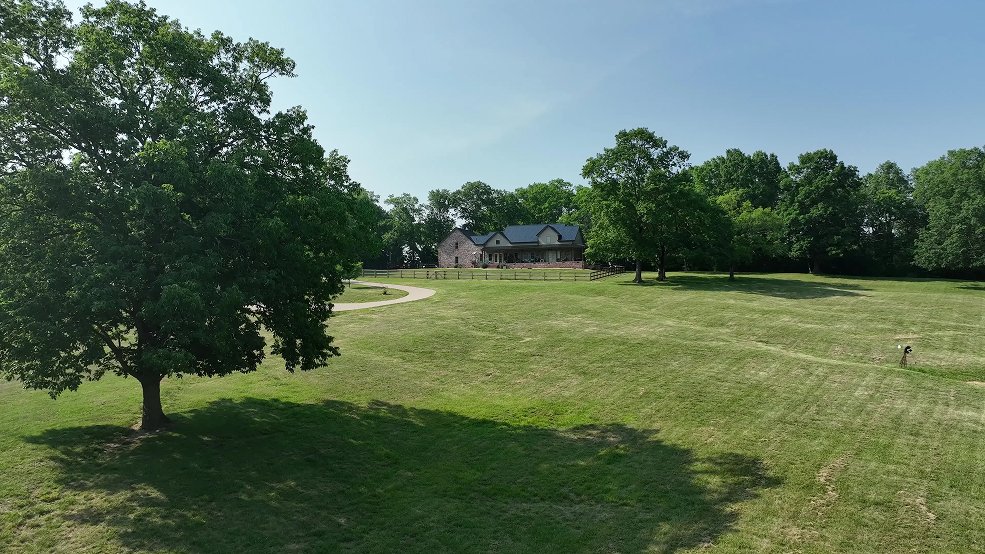 Black standing seam metal roof and pasture view in Columbia, Tennessee
