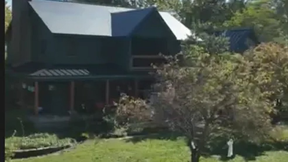 Custom metal shingle roof with standing seam accent sections