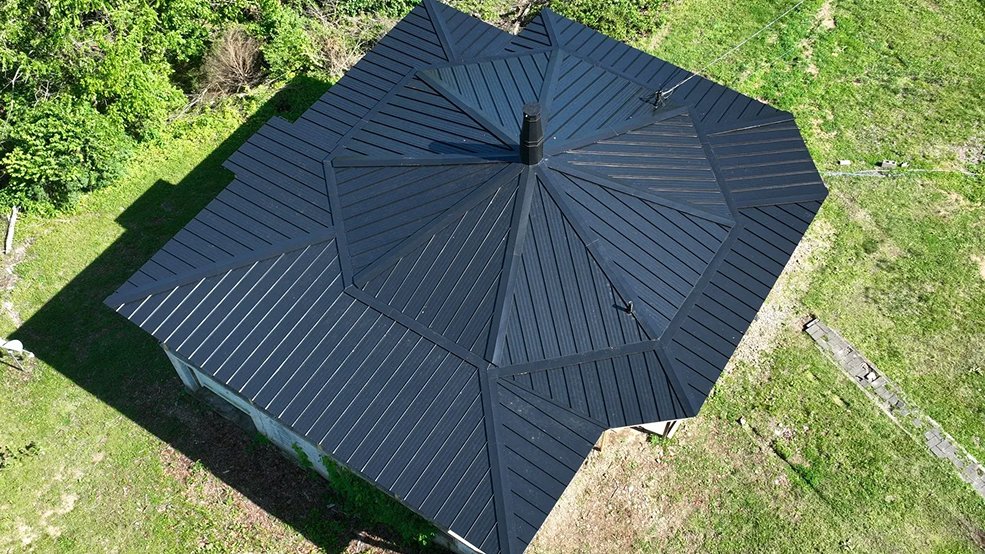 Black standing seam metal roof and long low roofline in Nolensville, TN