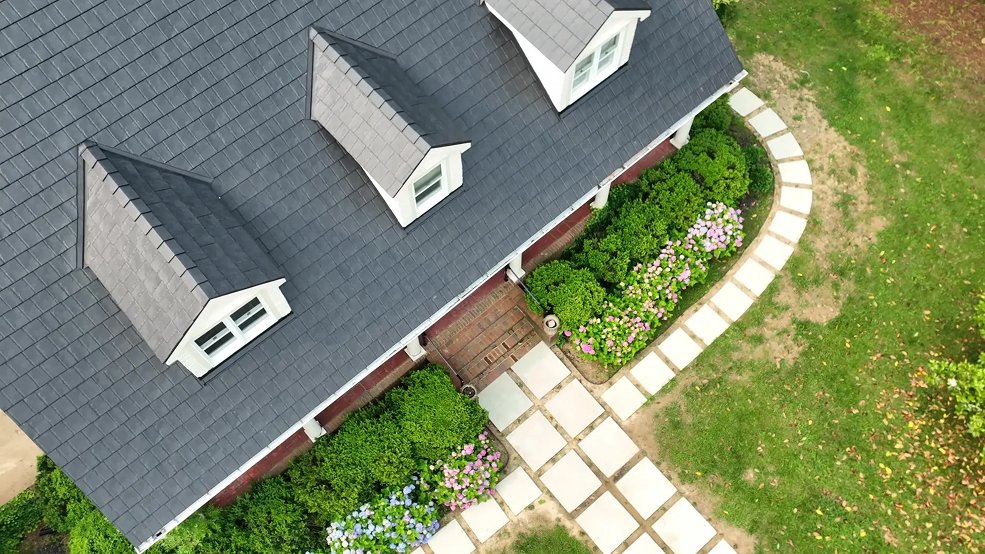 Black steel shingle roof panels close up