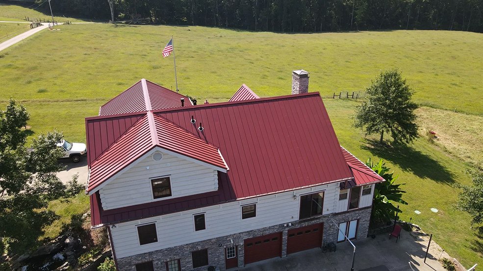 Red standing seam metal roof installed in Middle Tennessee