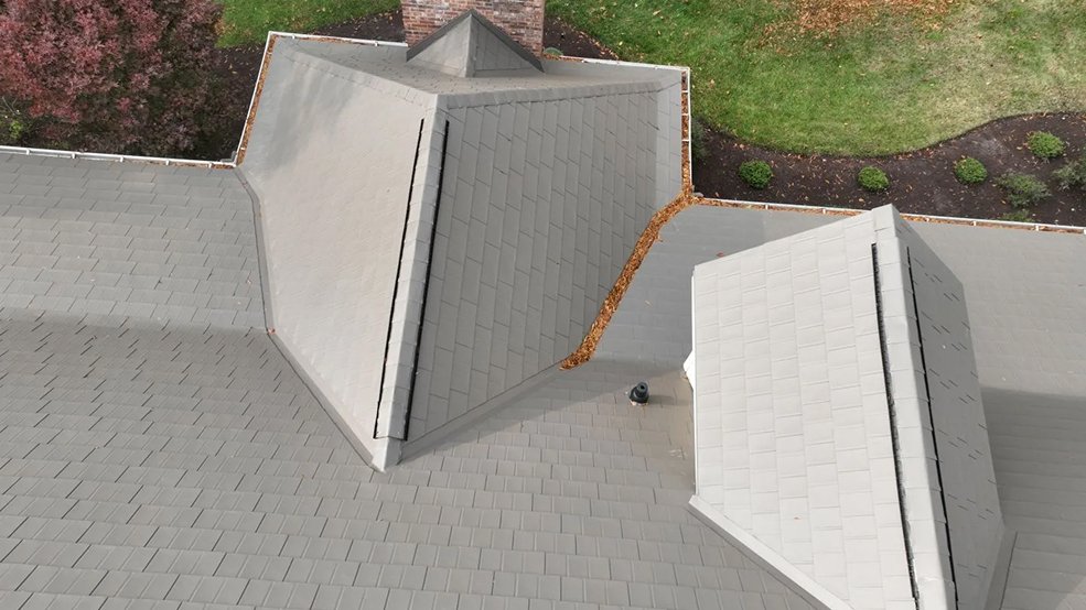 Metal shingle roof above the front entry of a brown home in Murfreesboro, TN