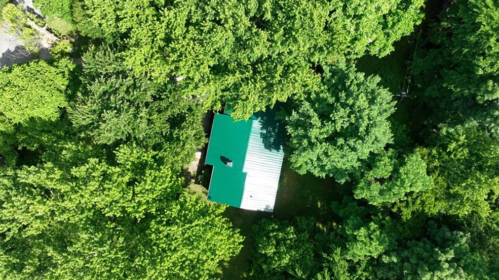 Green standing seam metal roof panels on a Tennessee home