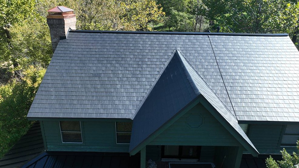Standing seam panels and metal shingles combined on one roof
